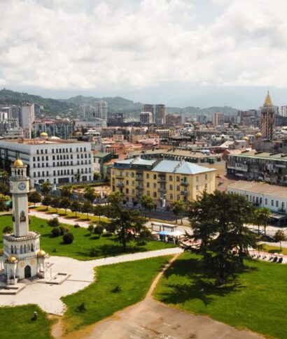 Aerial drone view of Batumi, Georgia Aerial drone view of Batumi, Georgia. Old and modern buildings, greenery, roads, mountains, cloudy sky