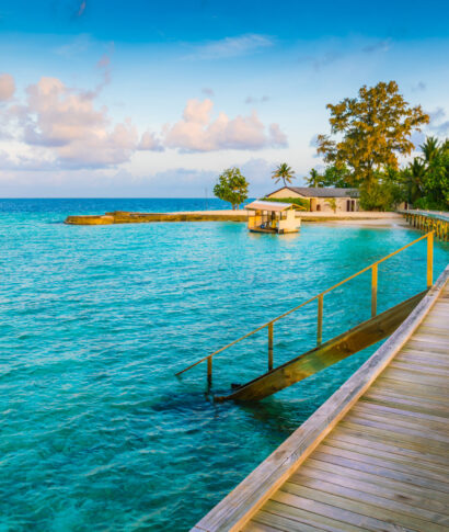 Beautiful water villas in tropical Maldives island at the sunrise time