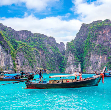 KRABI - DECEMBER 1: Long boat and tourist at Maya bay in Phi Phi Island. Photo taken on December 1,2016 in Krabi, Thailand.